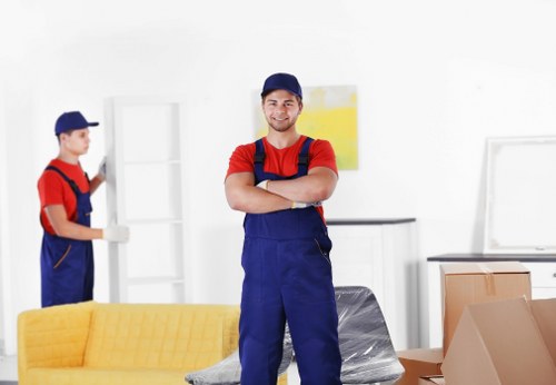 Experienced mover loading furniture into a truck