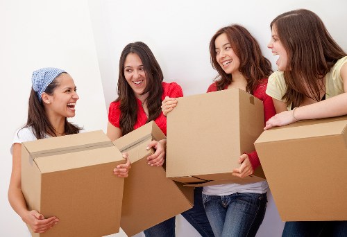 Professional mover loading furniture into a van